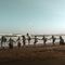 Gemeinschaft von Menschen am Strand